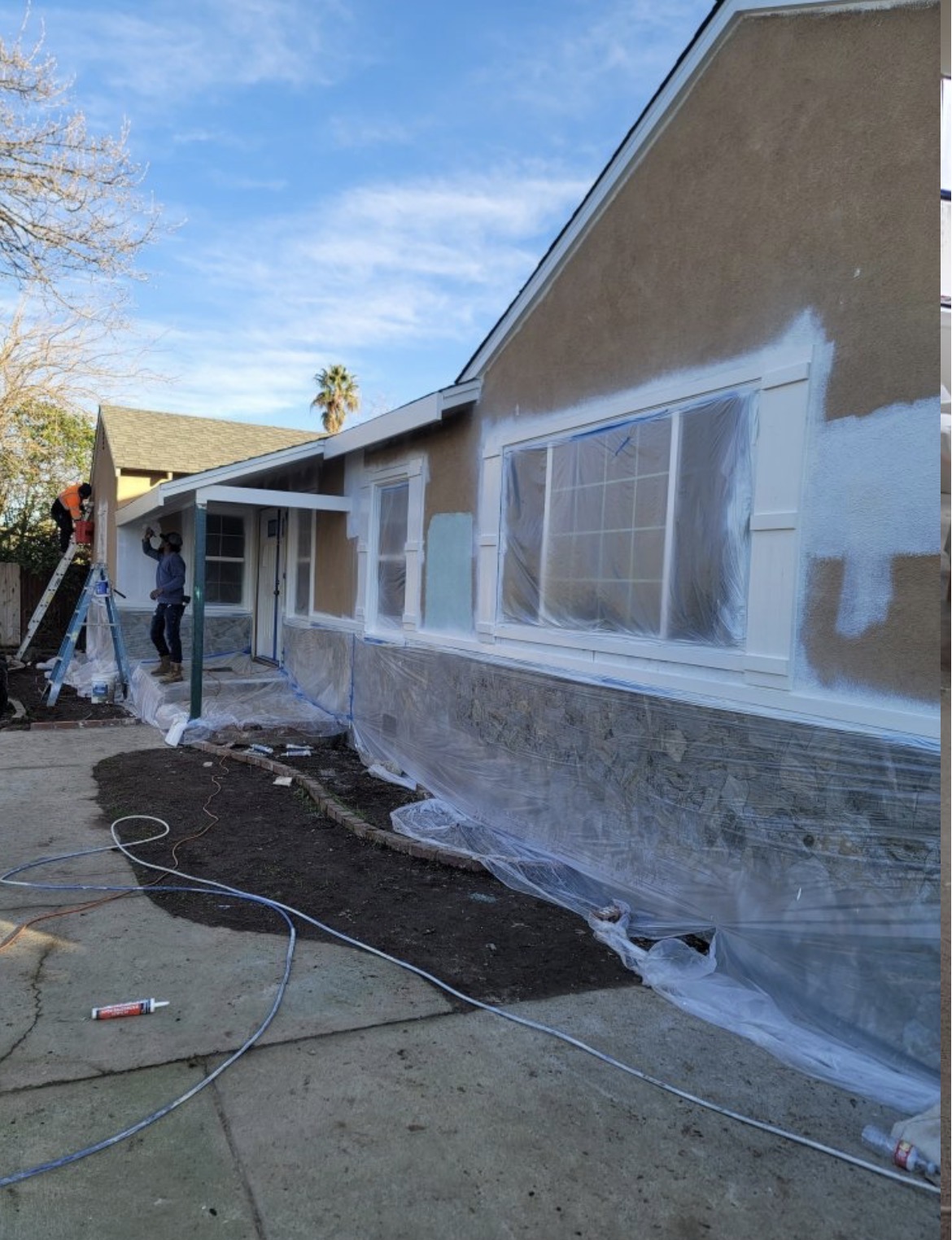 Painter cutting in a clean line along trim